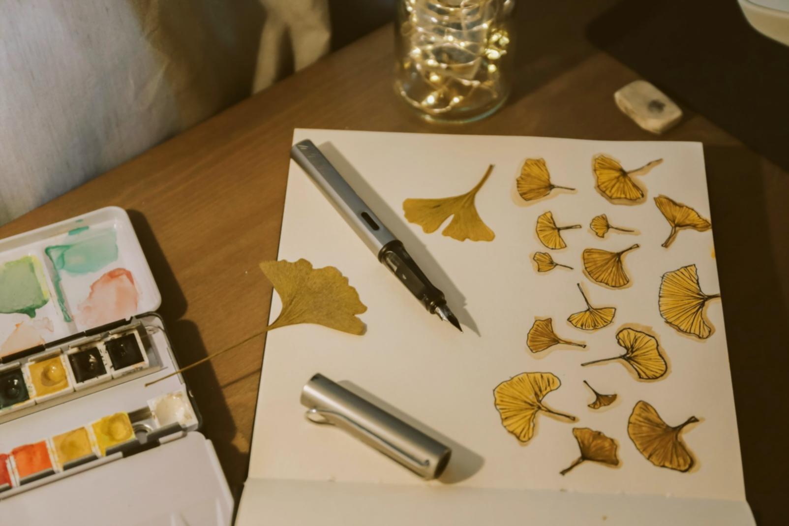 Creative workspace with illustration materials and learning resources